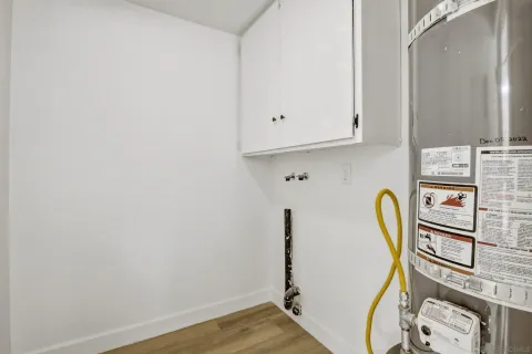 a view of appliances with wooden floor