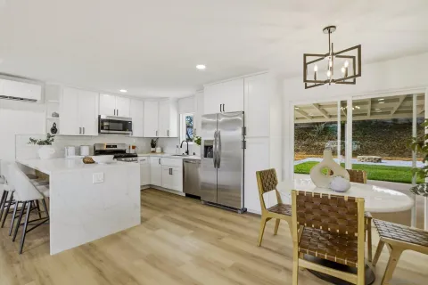 a kitchen with counter top space cabinets and stainless steel appliances