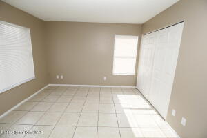 1021 Abada Court Northeast, Unit 102 Palm Bay, FL 32905 - Photo 11 of 16 a view of an empty room and window