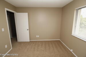 1021 Abada Court Northeast, Unit 102 Palm Bay, FL 32905 - Photo 15 of 16 a view of an empty room
