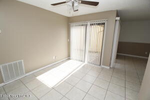 1021 Abada Court Northeast, Unit 102 Palm Bay, FL 32905 - Photo 5 of 16 a view of an empty room and window