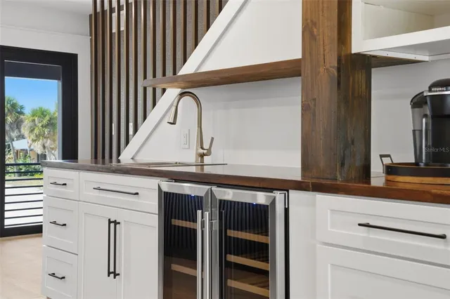 a view of a balcony with wooden floor