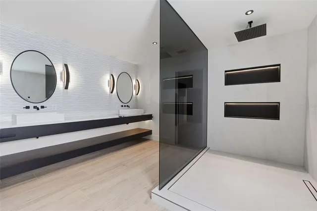 a bathroom with a mirror and a sink