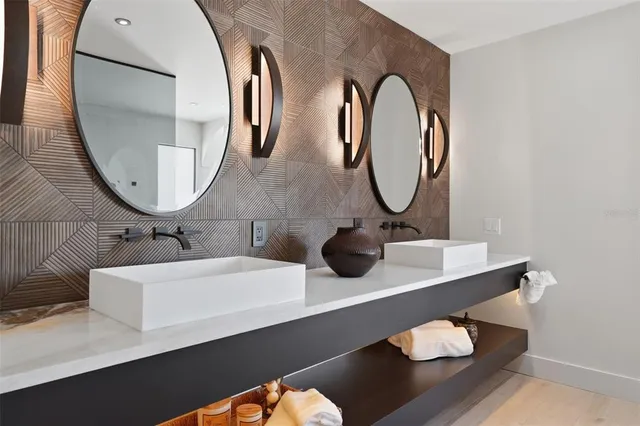 a bathroom with a shower and a glass door