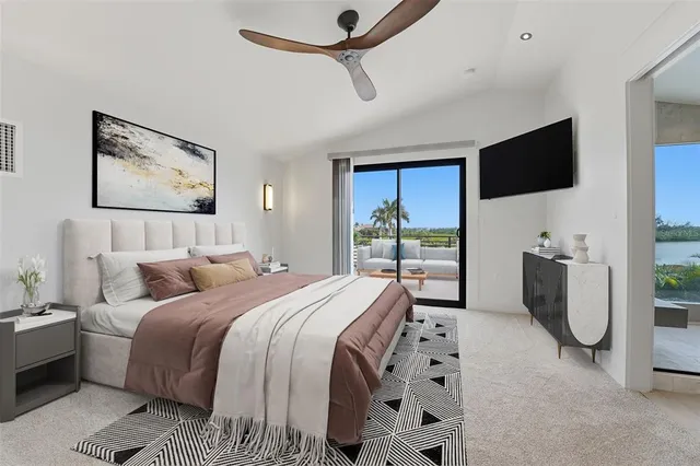 an aerial view of a house with a lake view