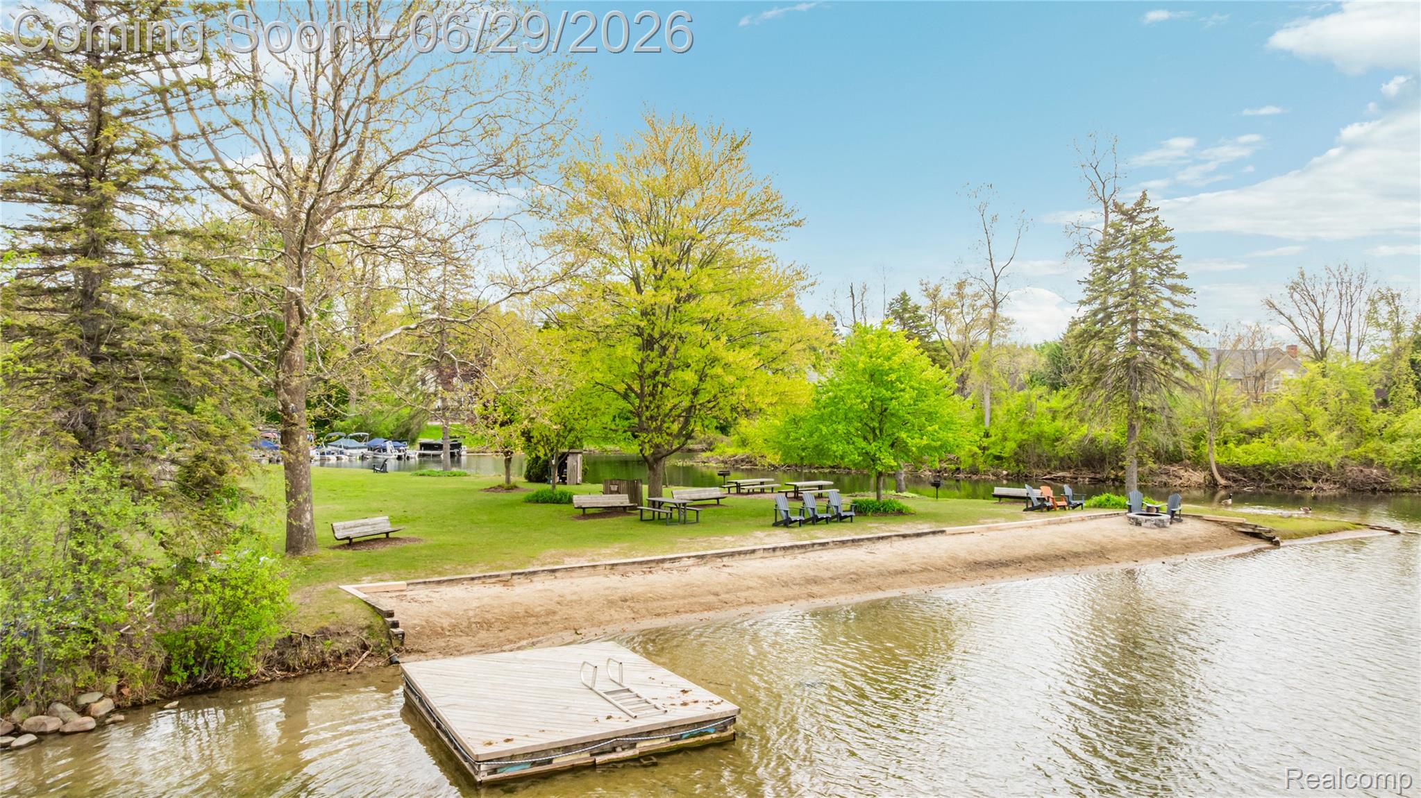 6085 Worlington Road Bloomfield Hills, MI 48301 - Photo 67 of 75 Association features a private sandy beach, a floating dock, and abundant mature trees