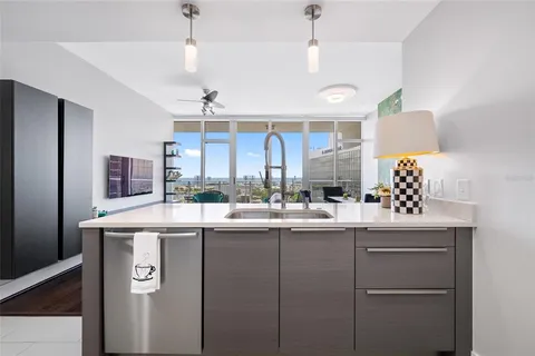 a kitchen that has a sink and cabinets
