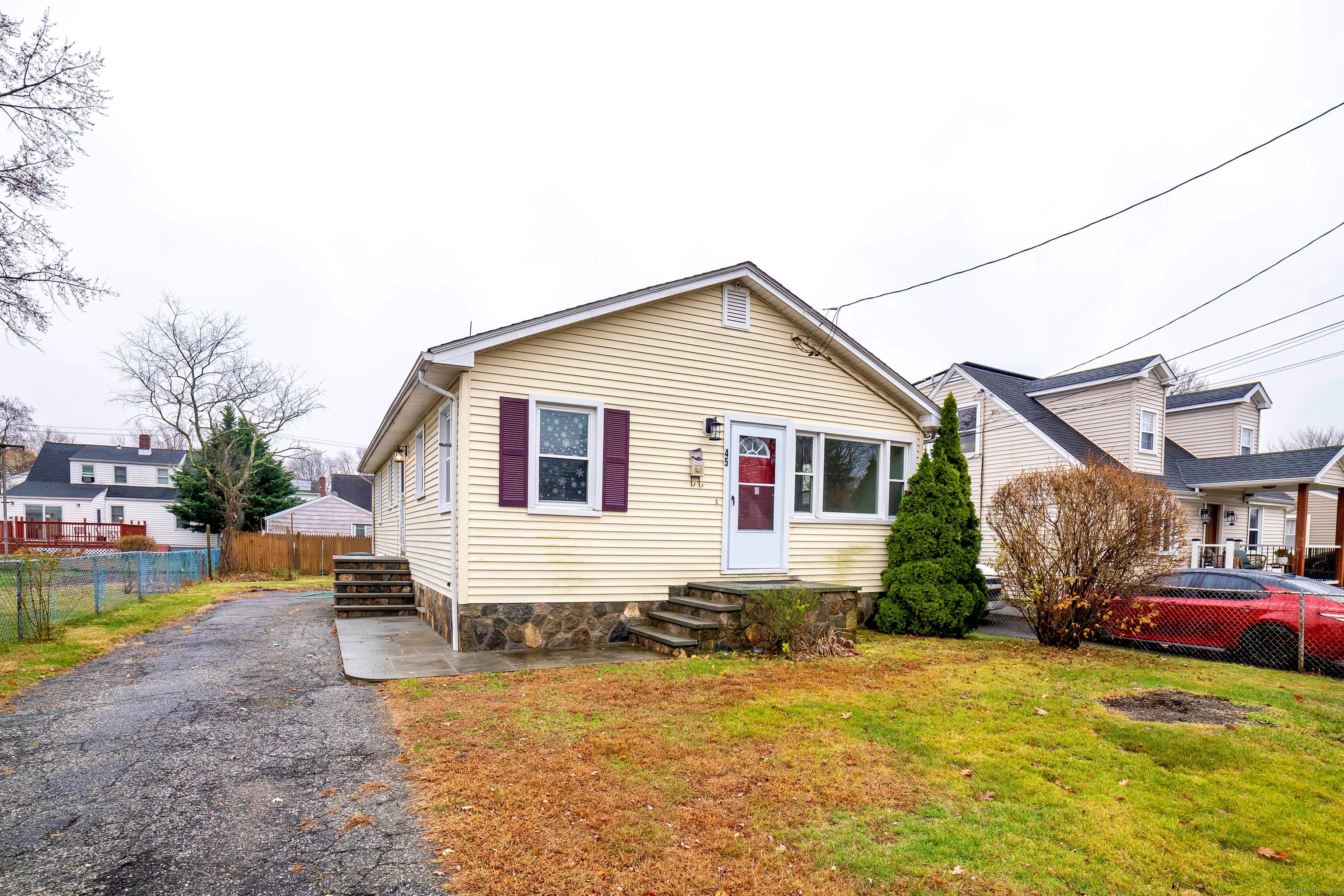 45 Voight Avenue Bridgeport, CT 06606 - Photo 3 of 27 a front view of a house with a yard
