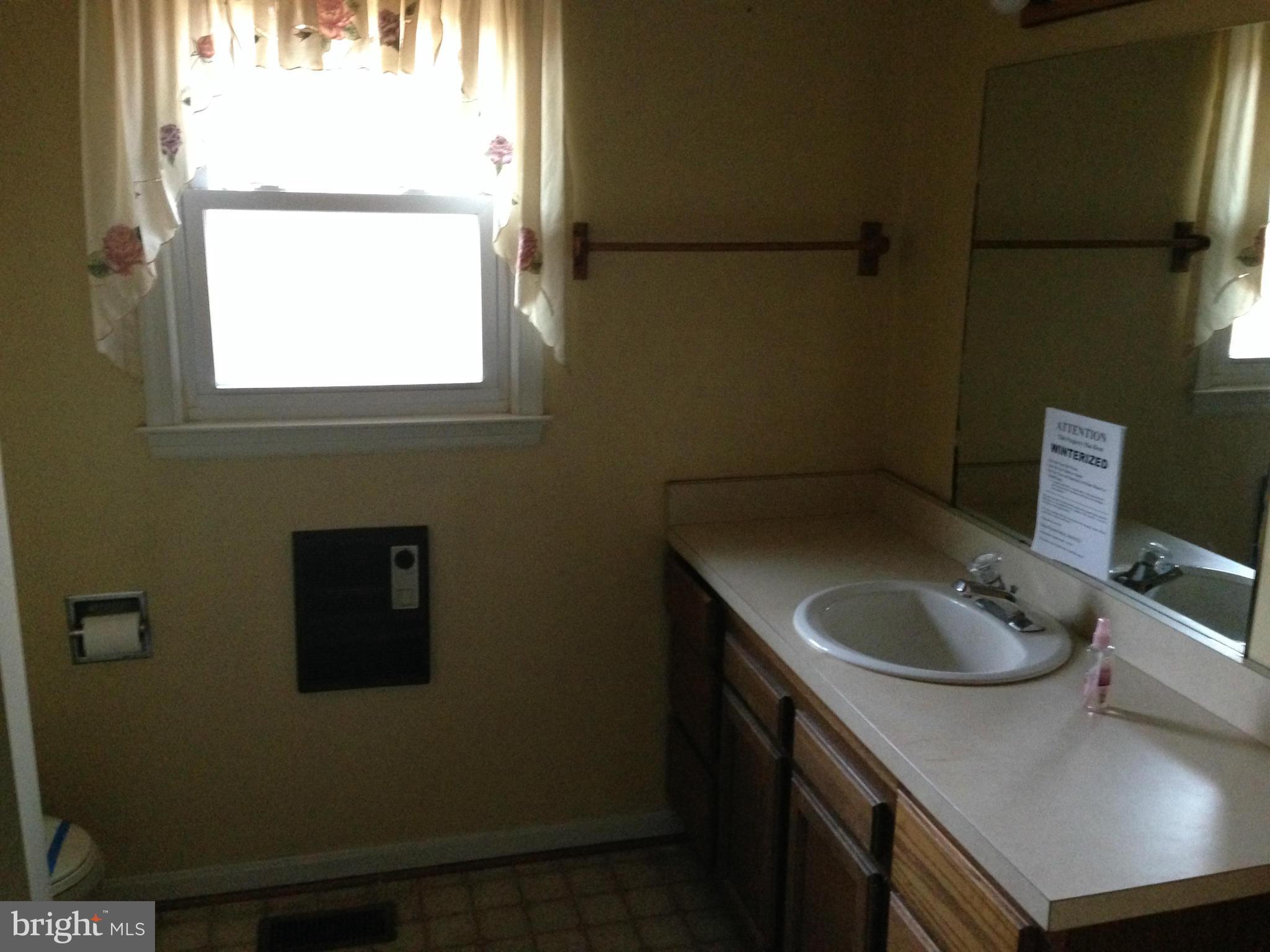 5176 Stewart Road Sumerduck, VA 22742 - Photo 7 of 10 a kitchen with a sink cabinets and a window