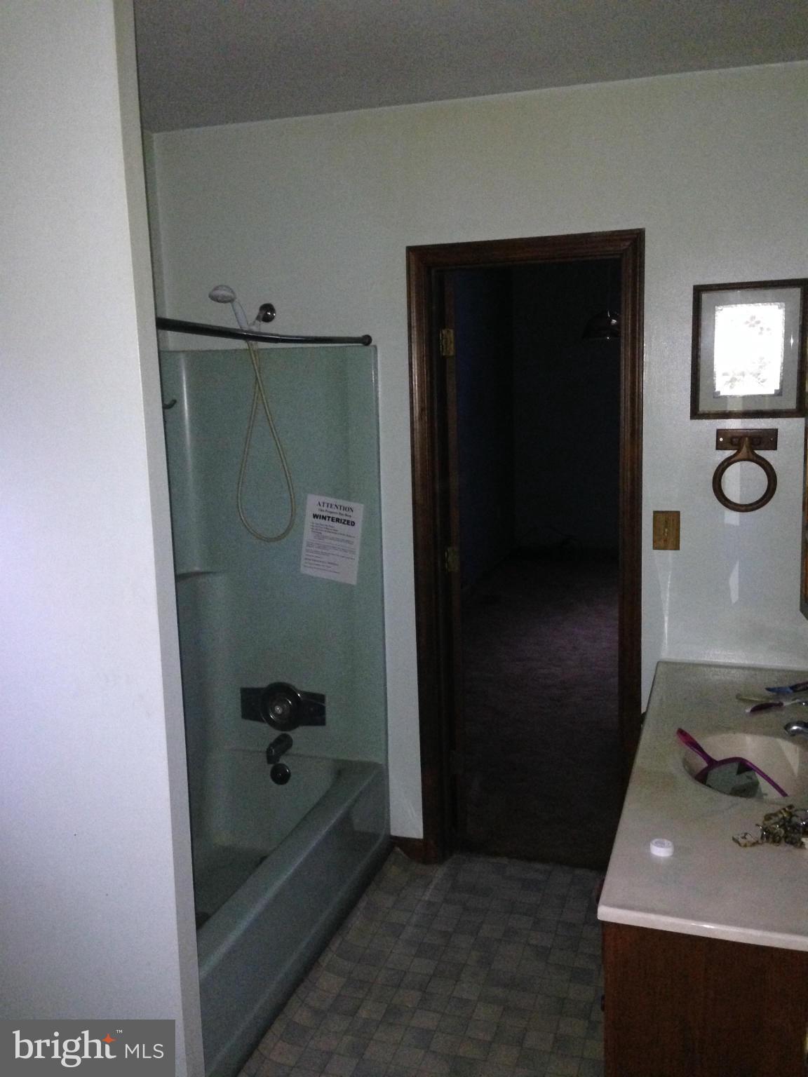 5176 Stewart Road Sumerduck, VA 22742 - Photo 8 of 10 a bathroom with a bathtub and a sink