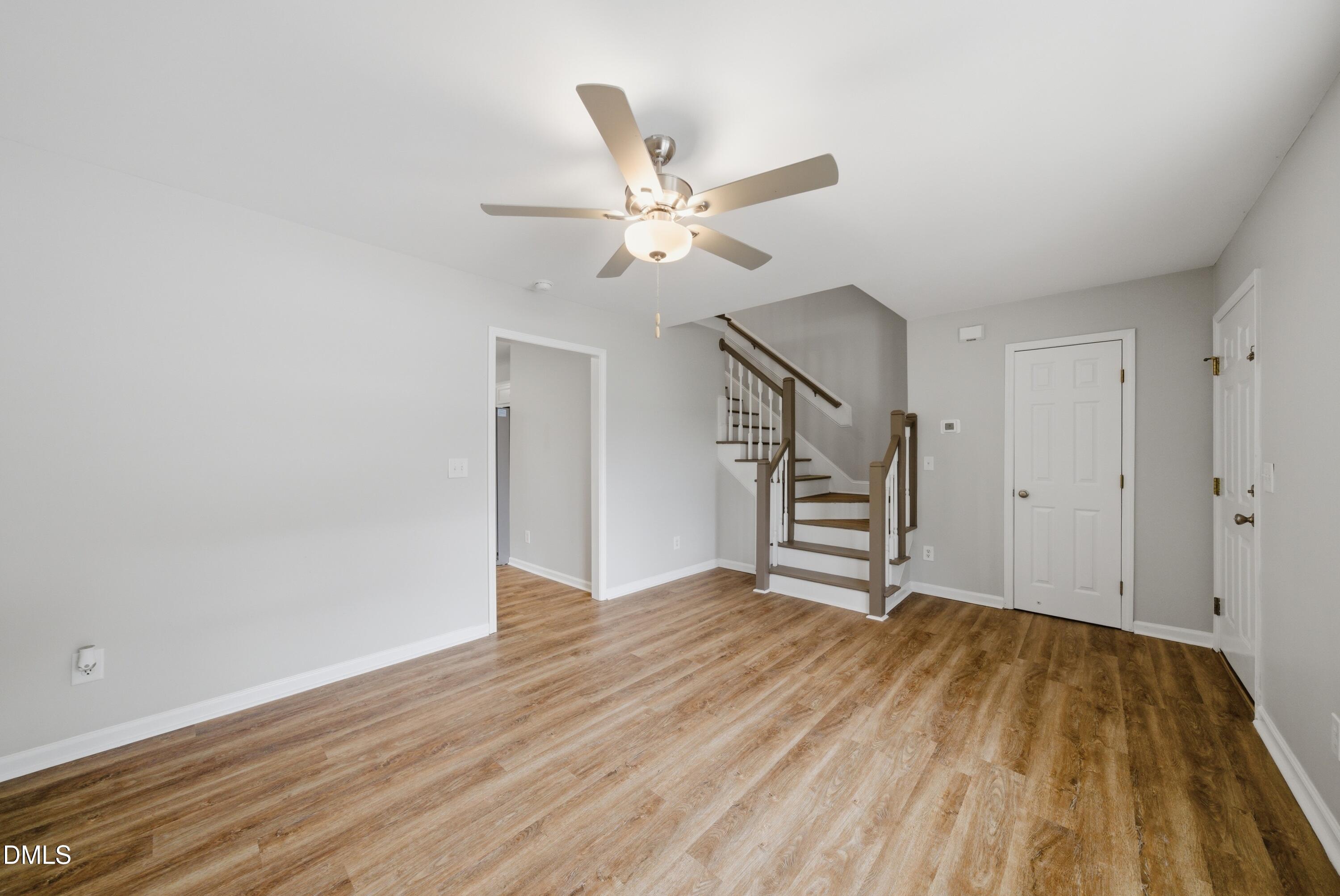 201 Tonylee Court, Unit A Raleigh, NC 27603 - Photo 10 of 30 wooden floor in an empty room with a window