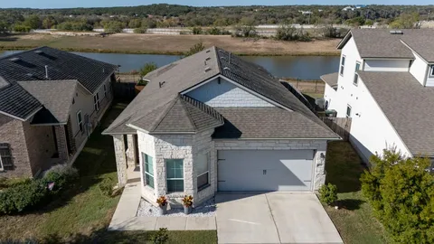 an aerial view of a house with a lake view