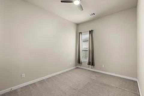 a bathroom with a sink a toilet a mirror and shower