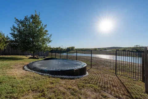 a view of a chairs and table in the balcony