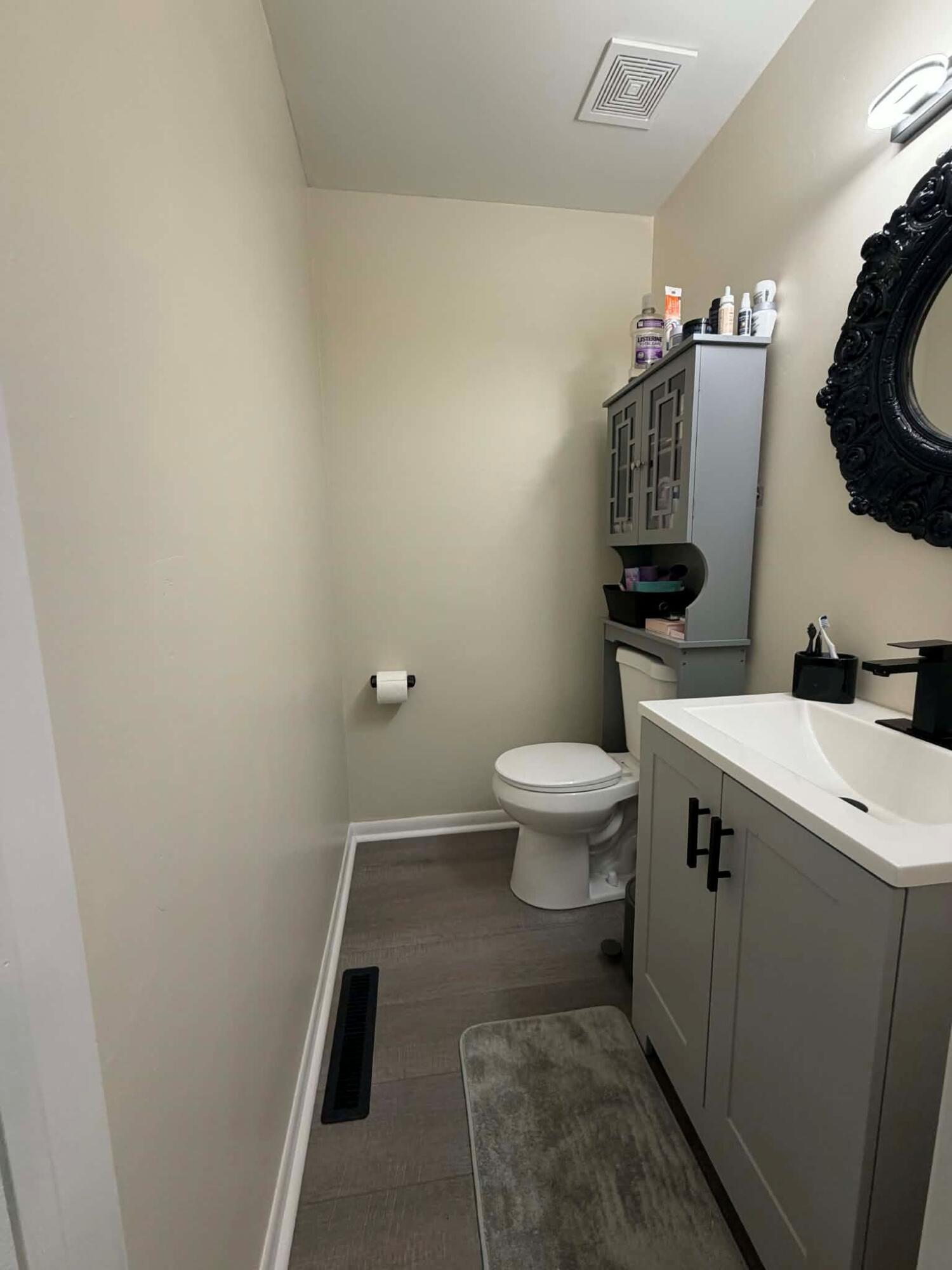 716 East Stewart Drive Rensselaer, IN 47978 - Photo 11 of 22 a bathroom with a toilet and a sink