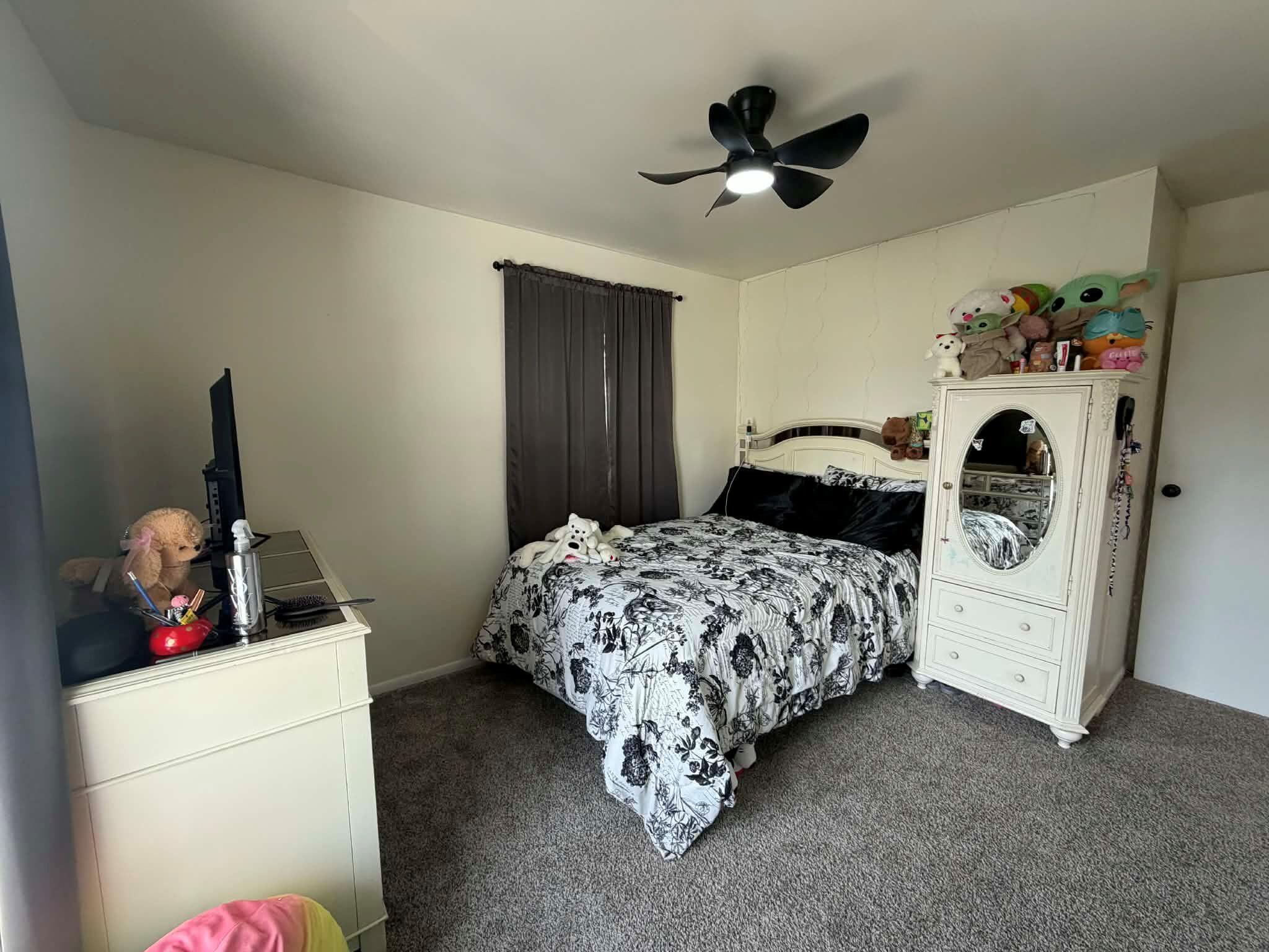 716 East Stewart Drive Rensselaer, IN 47978 - Photo 12 of 22 a bedroom with a bed and a dresser