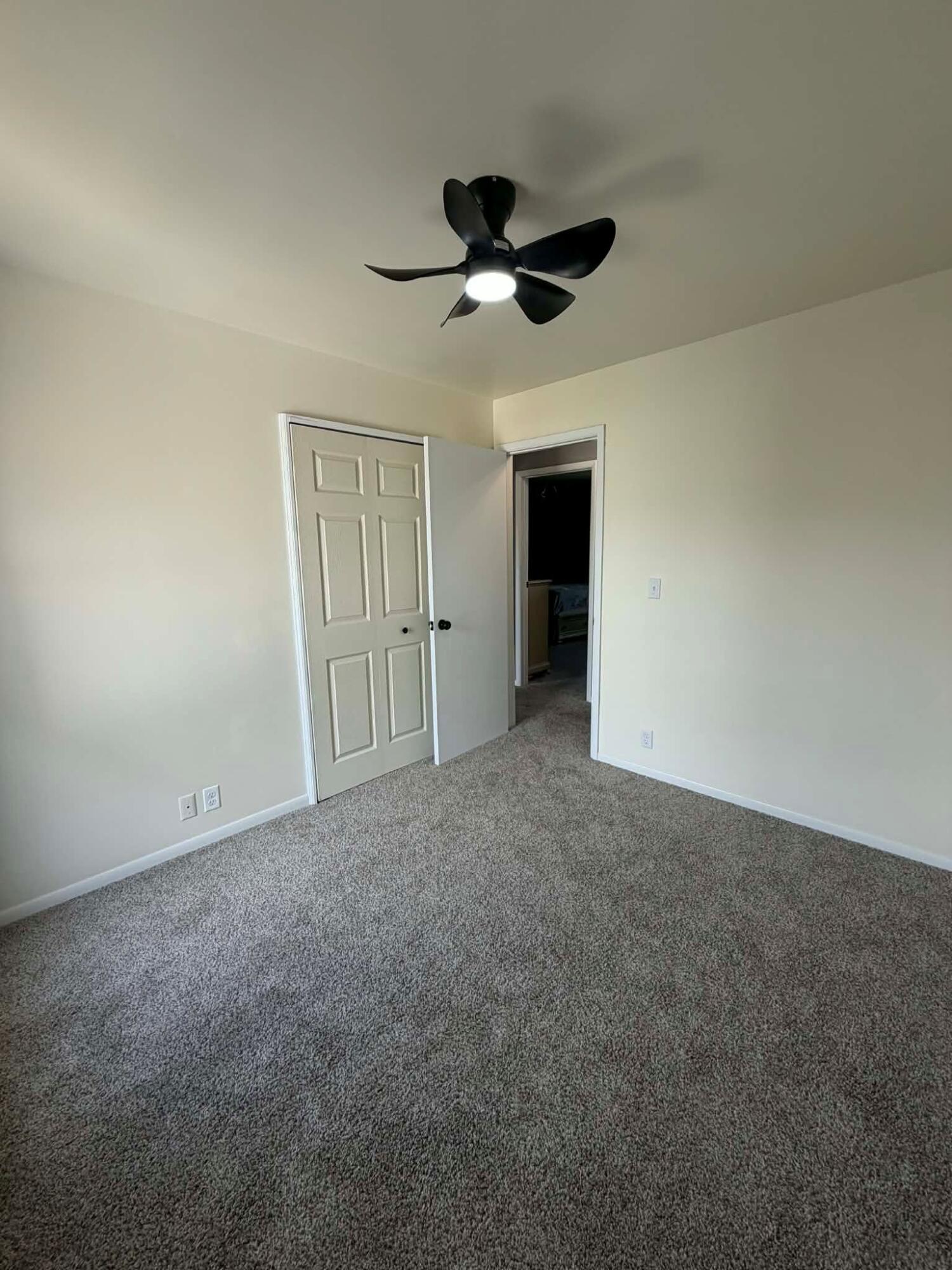 716 East Stewart Drive Rensselaer, IN 47978 - Photo 14 of 22 an empty room with a ceiling fan and a window