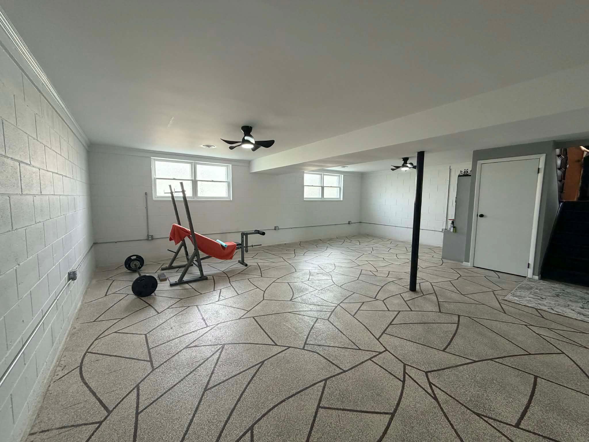 716 East Stewart Drive Rensselaer, IN 47978 - Photo 17 of 22 a view of a room with gym equipment and windows