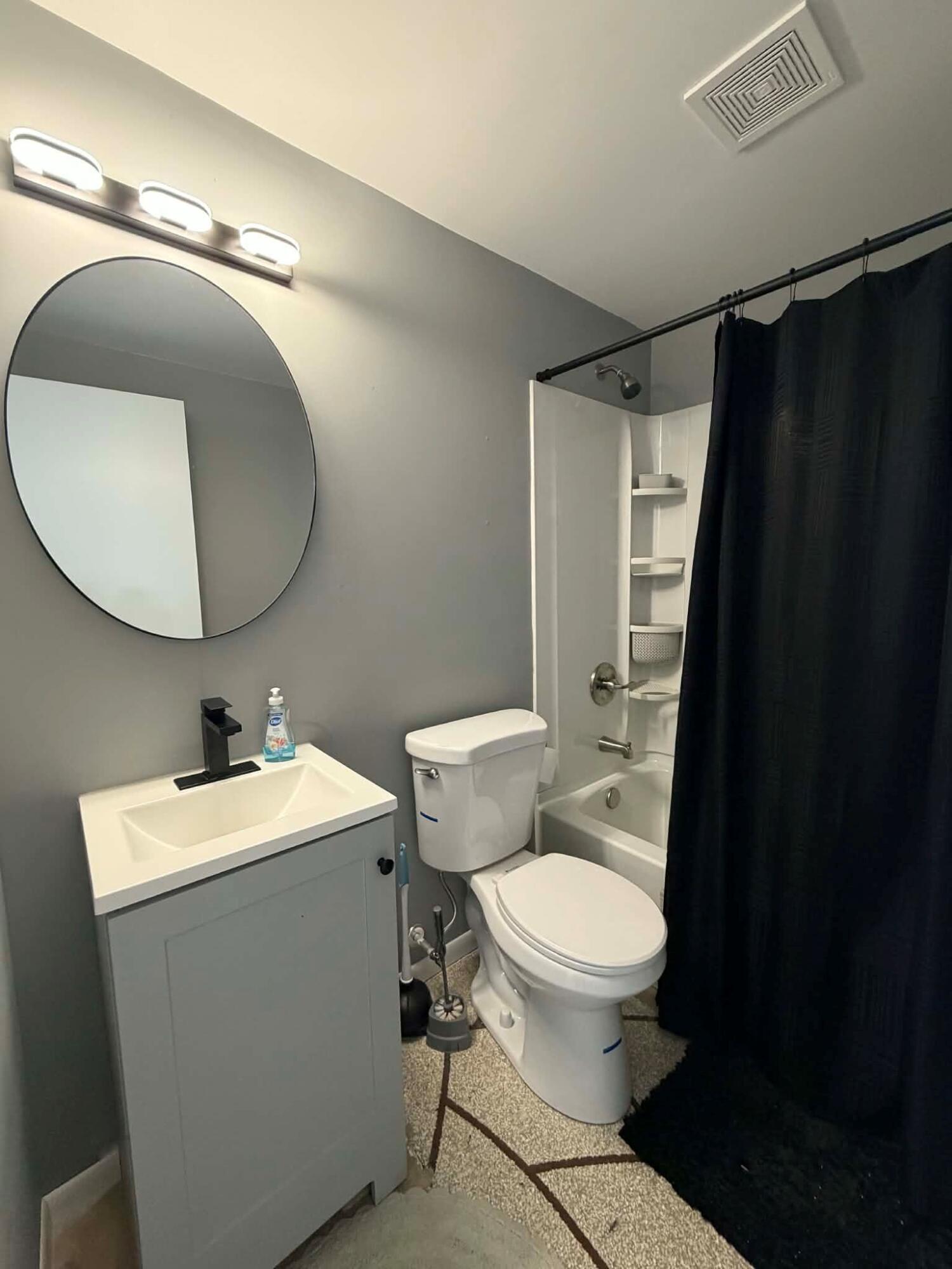 716 East Stewart Drive Rensselaer, IN 47978 - Photo 19 of 22 a bathroom with a sink mirror vanity and toilet