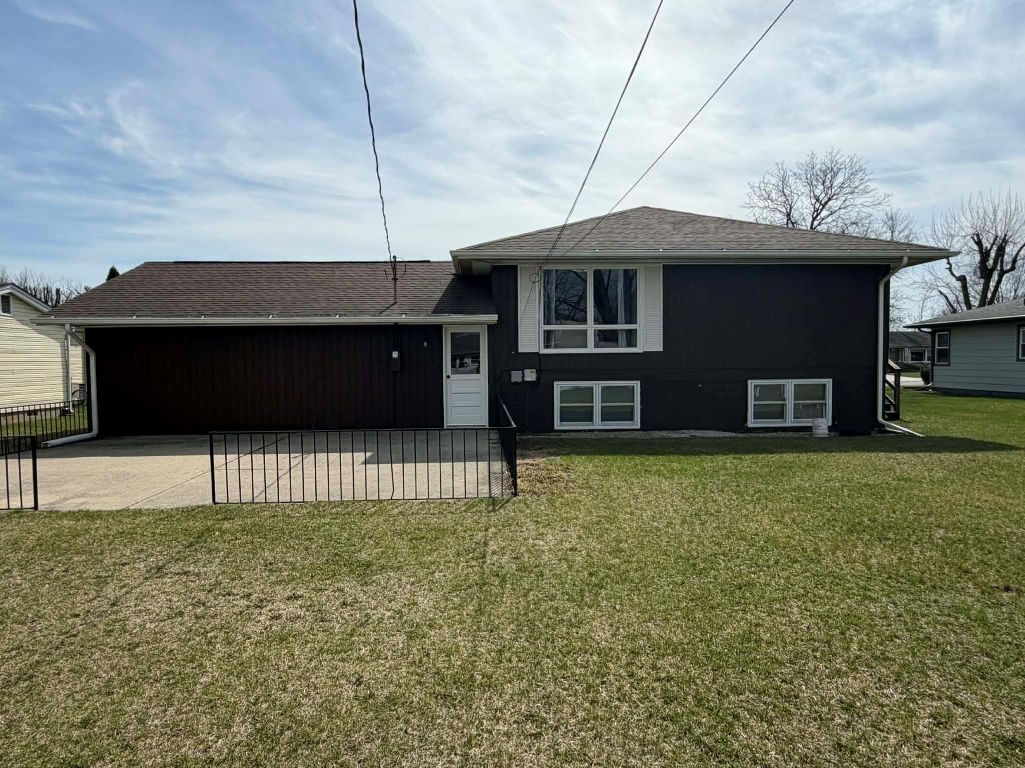 716 East Stewart Drive Rensselaer, IN 47978 - Photo 2 of 22 a front view of a house with a garden