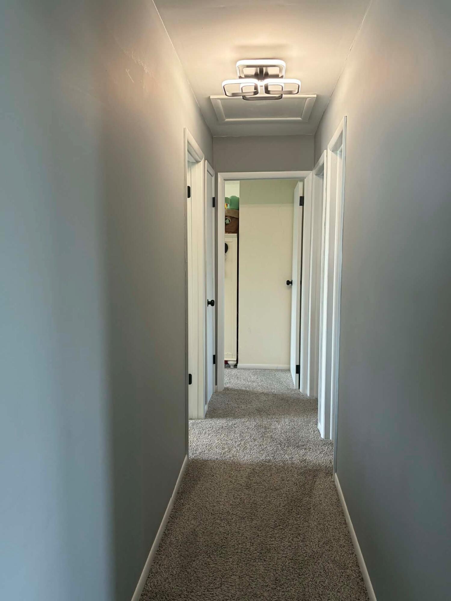 716 East Stewart Drive Rensselaer, IN 47978 - Photo 8 of 22 a view of a hallway with wooden floor