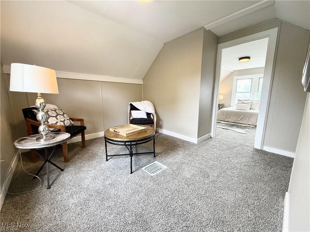 281 Sexton Street Struthers, OH 44471 - Photo 24 of 28 Sitting room with carpet floors, lofted ceiling, and a decorative wall