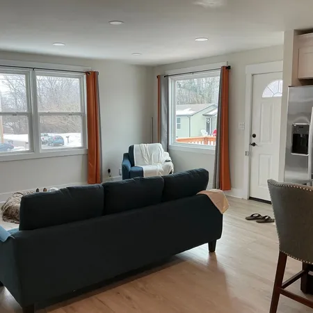 a living room with furniture and a large window