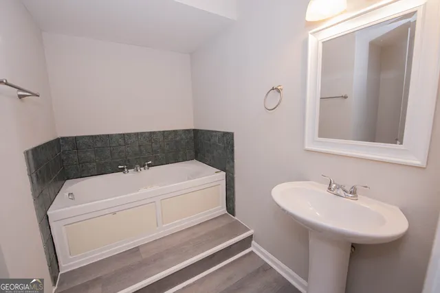 a bathroom with a sink and a mirror