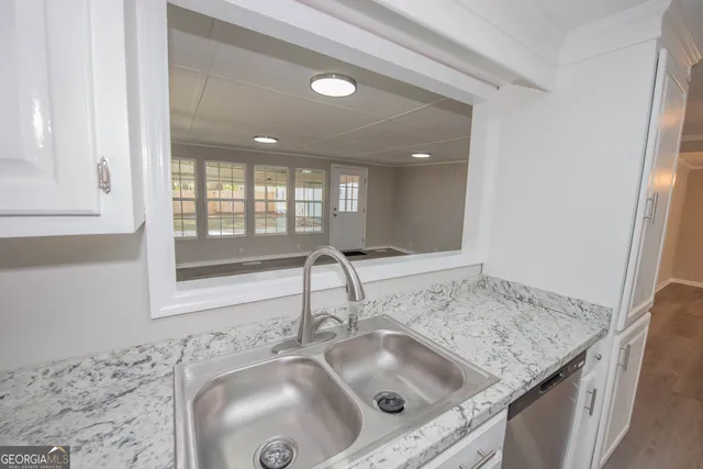 a kitchen with a sink and a window