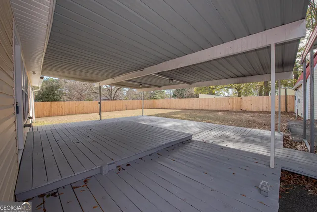 a view of outdoor space with wooden floor