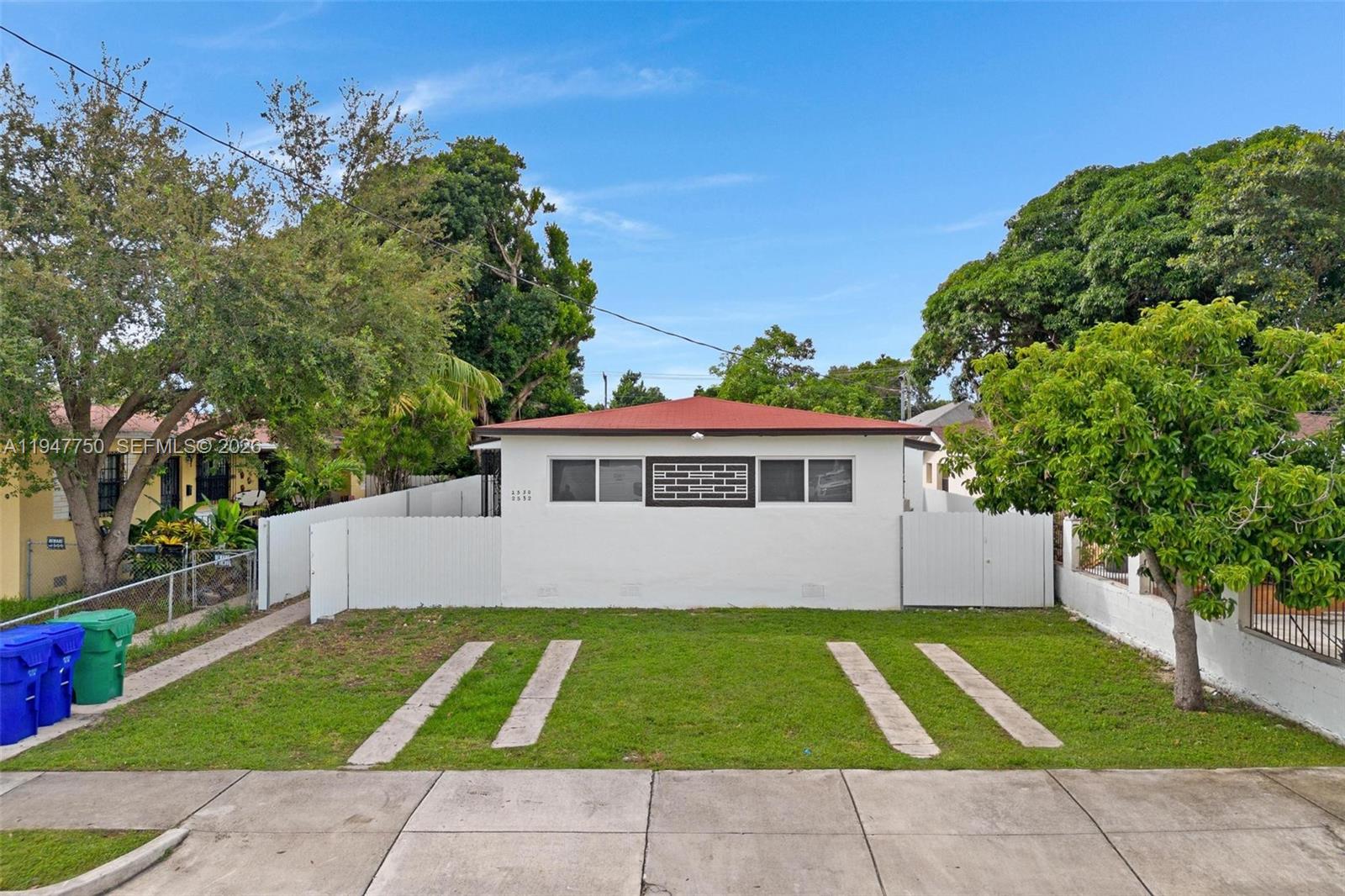 front view of a house with a yard