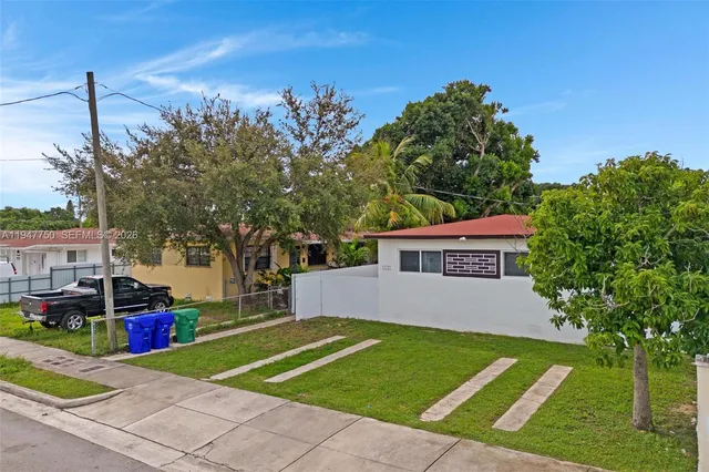 a house view with a garden space