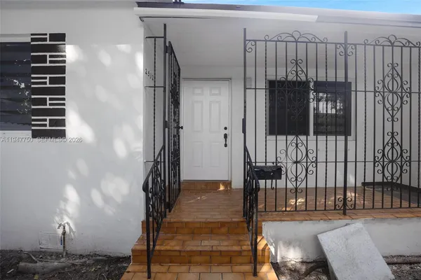 a view of a house with a yard and garage