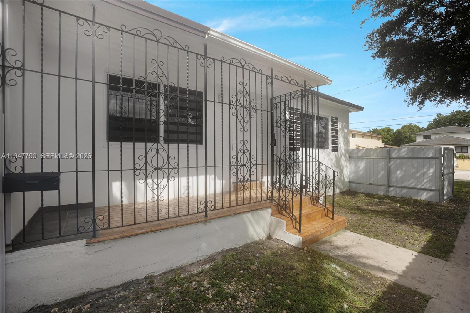 2530 Southwest 16th Terrace, Unit 1 Miami, FL 33145 - Photo 32 of 48 a view of a backyard with a wooden fence