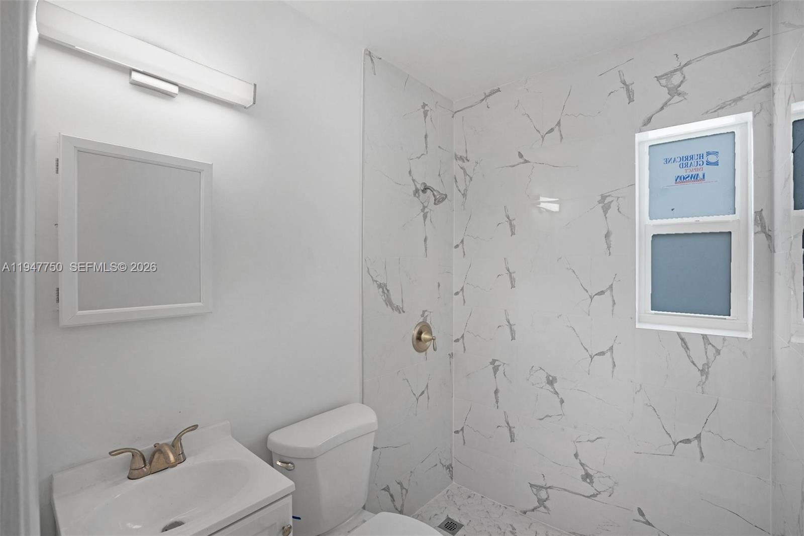 2530 Southwest 16th Terrace, Unit 1 Miami, FL 33145 - Photo 36 of 48 a bathroom with a toilet sink and shower