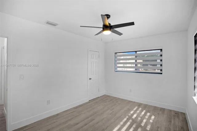 a view of an empty room and window