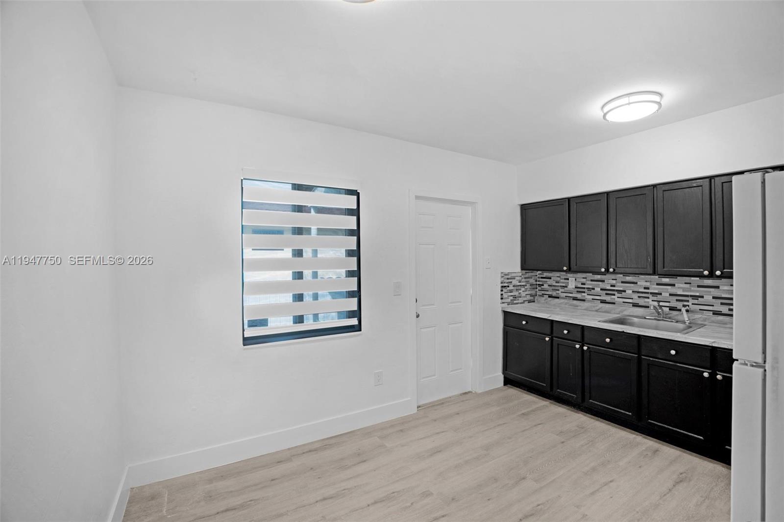 2530 Southwest 16th Terrace, Unit 1 Miami, FL 33145 - Photo 44 of 48 a view of kitchen with stainless steel appliances granite countertop cabinets and stove top oven