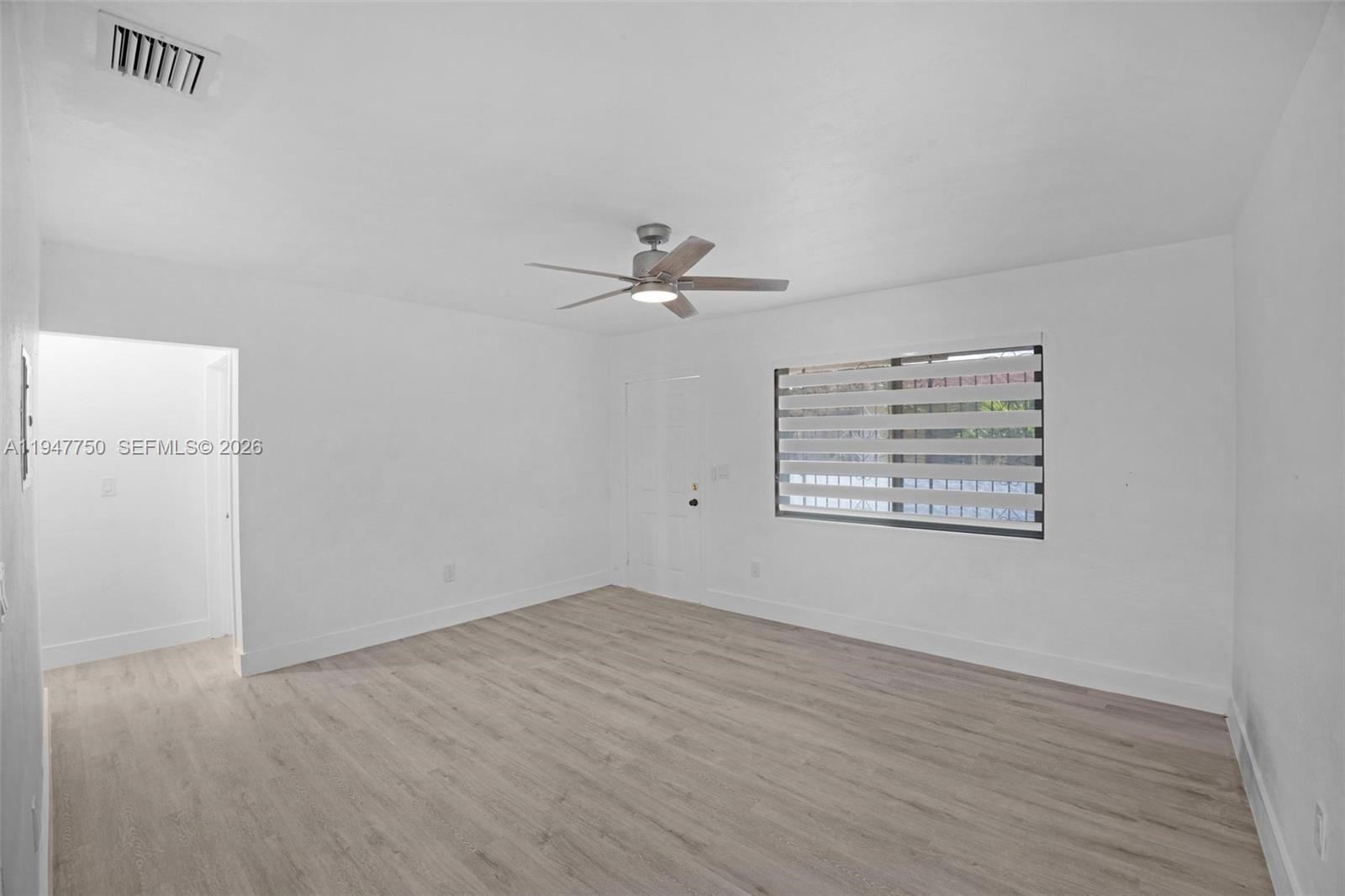 2530 Southwest 16th Terrace, Unit 1 Miami, FL 33145 - Photo 45 of 48 a view of a room with wooden floor and a ceiling fan