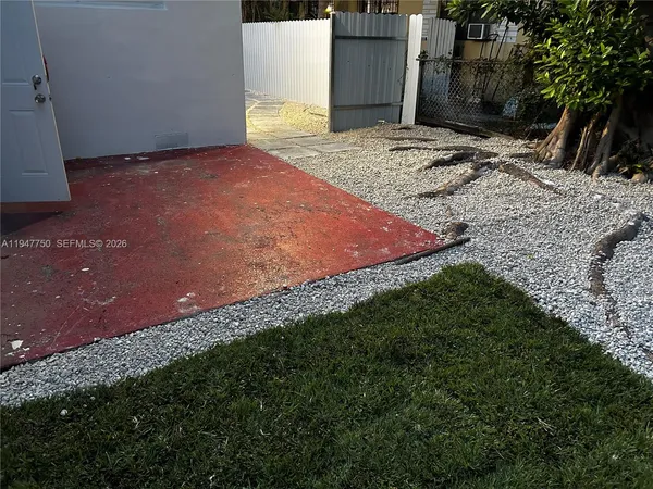 a view of a backyard of the house
