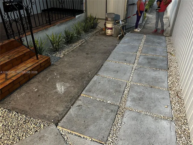 a view of a backyard with sitting area