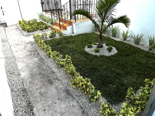 a view of a swimming pool with a yard