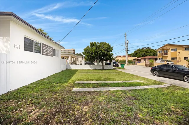 a view of yard with swimming pool