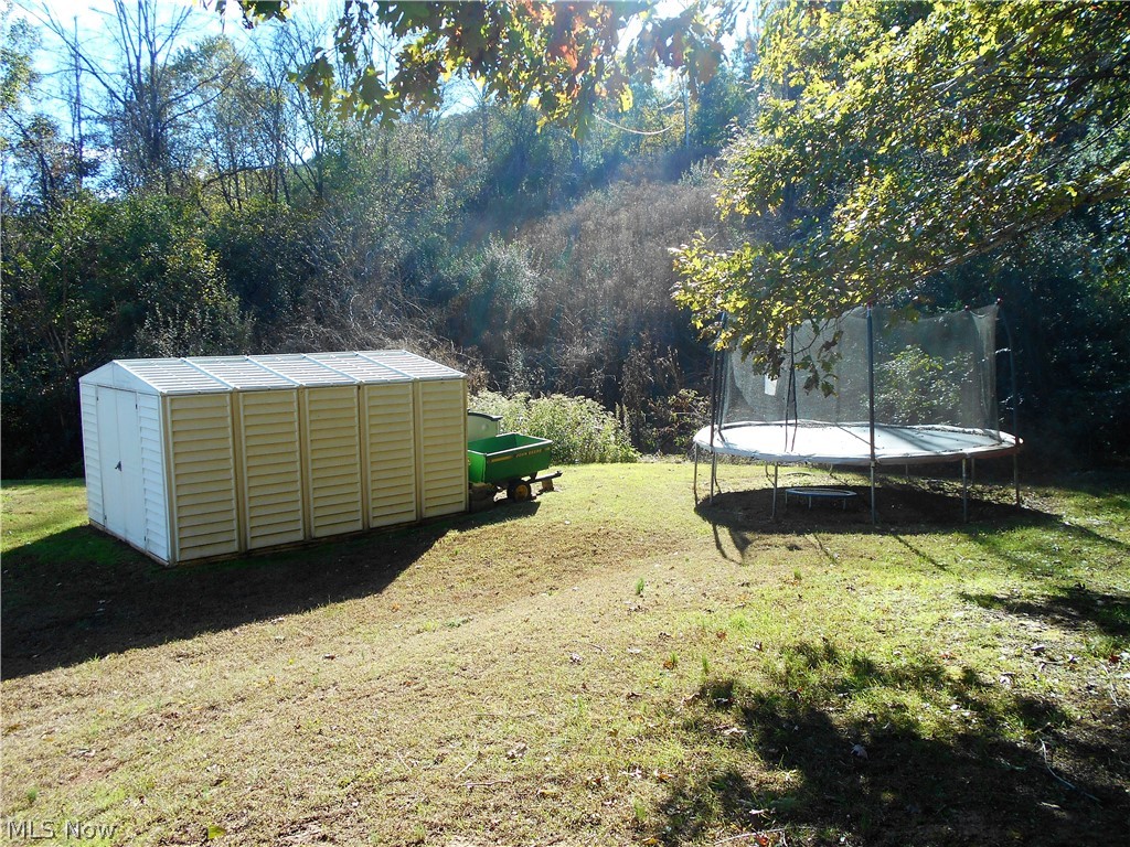 25 Tanglewood Road Belpre, OH 45714 - Photo 27 of 28 Side yard storage building stays (trampoline is negotiable)