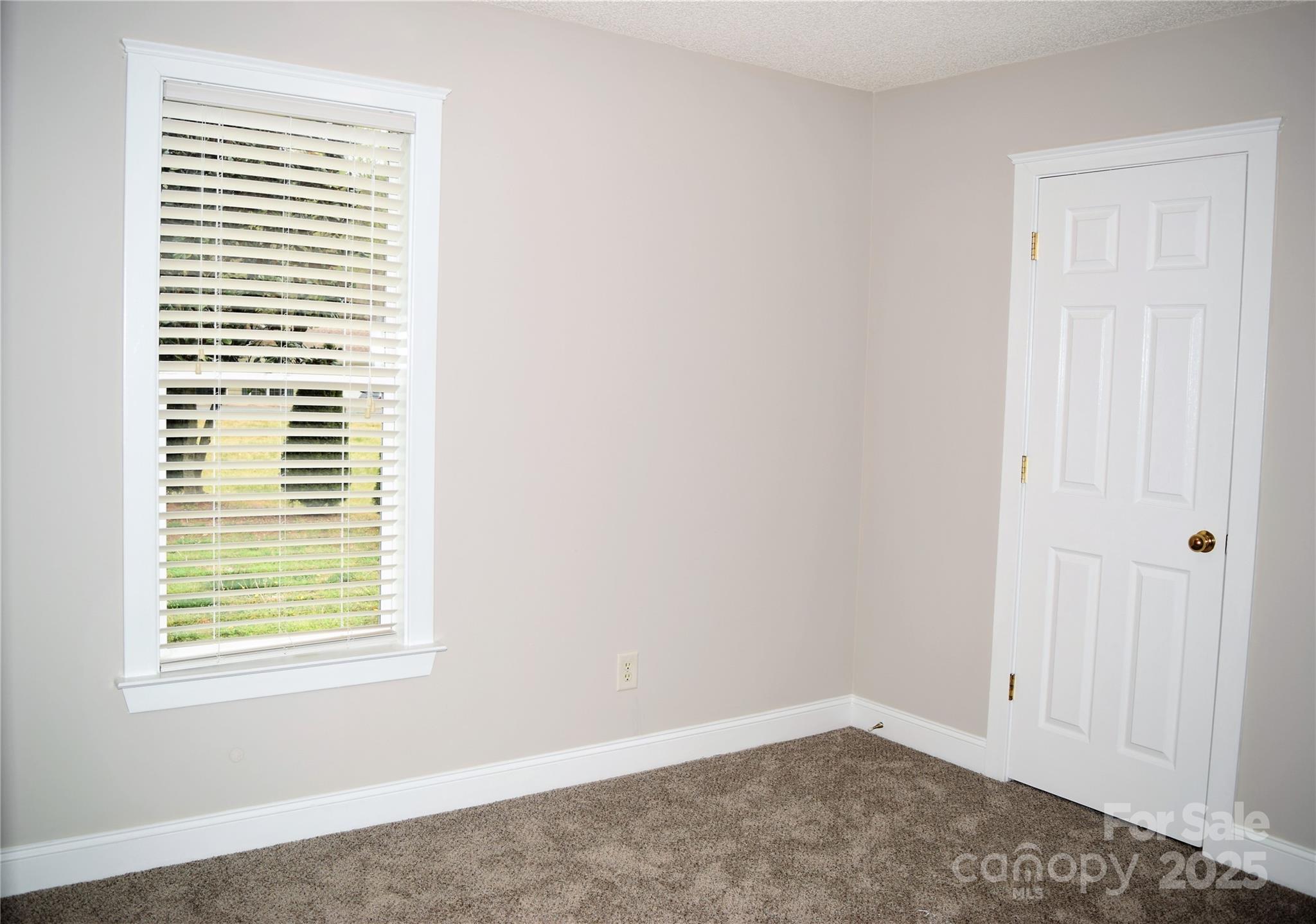 13840 Hastings Farm Road Huntersville, NC 28078 - Photo 19 of 32 an empty room with a window