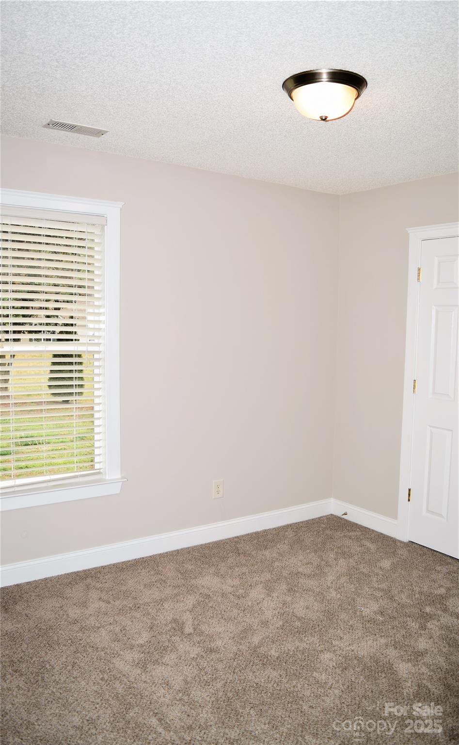 13840 Hastings Farm Road Huntersville, NC 28078 - Photo 20 of 32 an empty room with a window