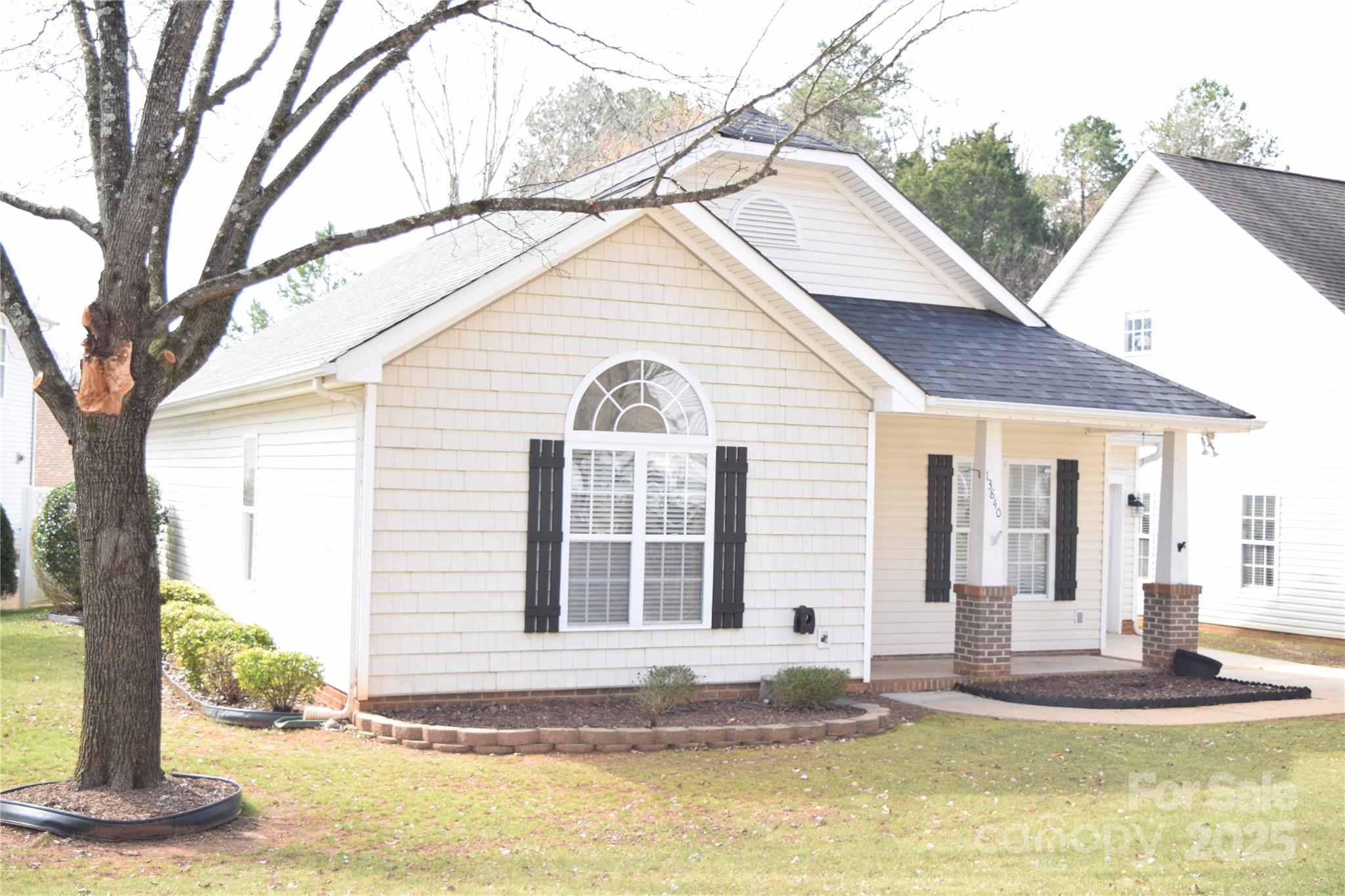 13840 Hastings Farm Road Huntersville, NC 28078 - Photo 2 of 32 a front view of a house with a yard and garage