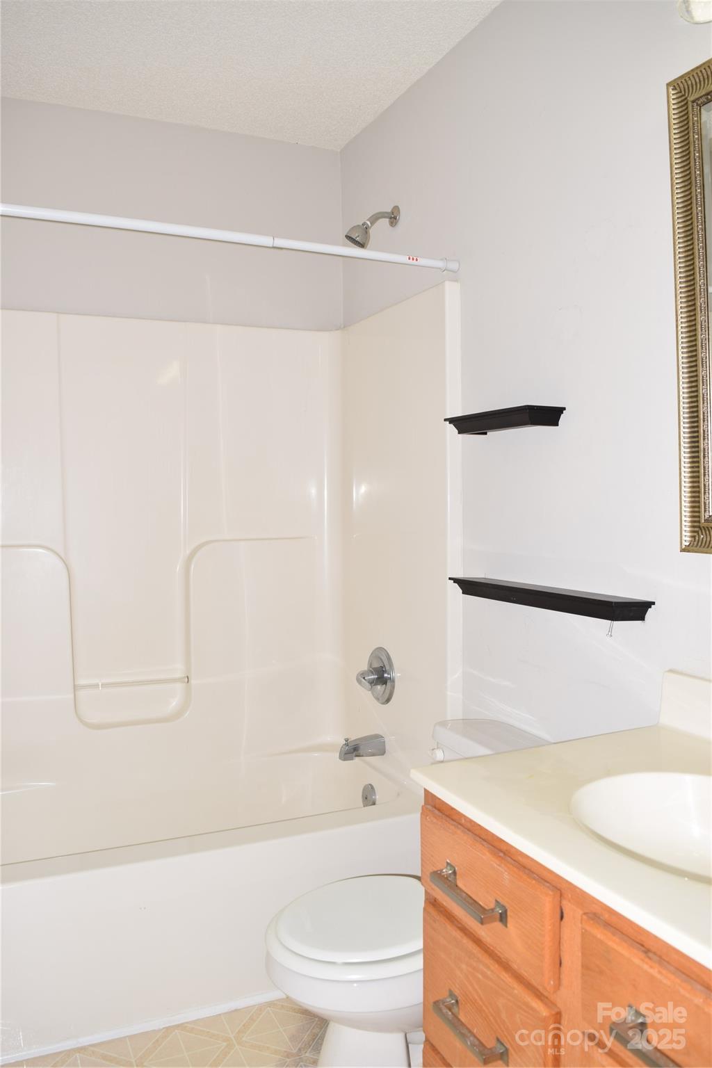13840 Hastings Farm Road Huntersville, NC 28078 - Photo 22 of 32 a bathroom with a sink a toilet and a bathtub