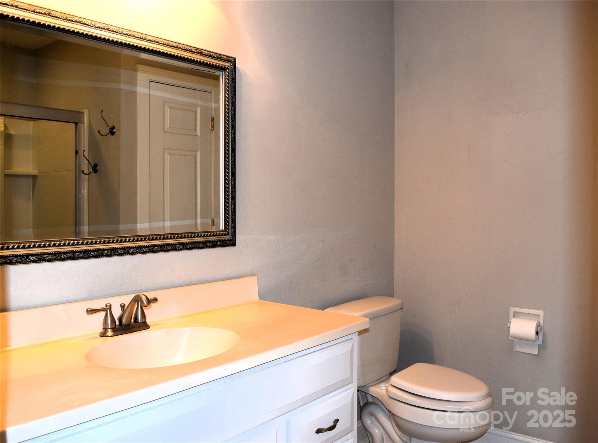 13840 Hastings Farm Road Huntersville, NC 28078 - Photo 25 of 32 a bathroom with a granite countertop sink vanity mirror and toilet
