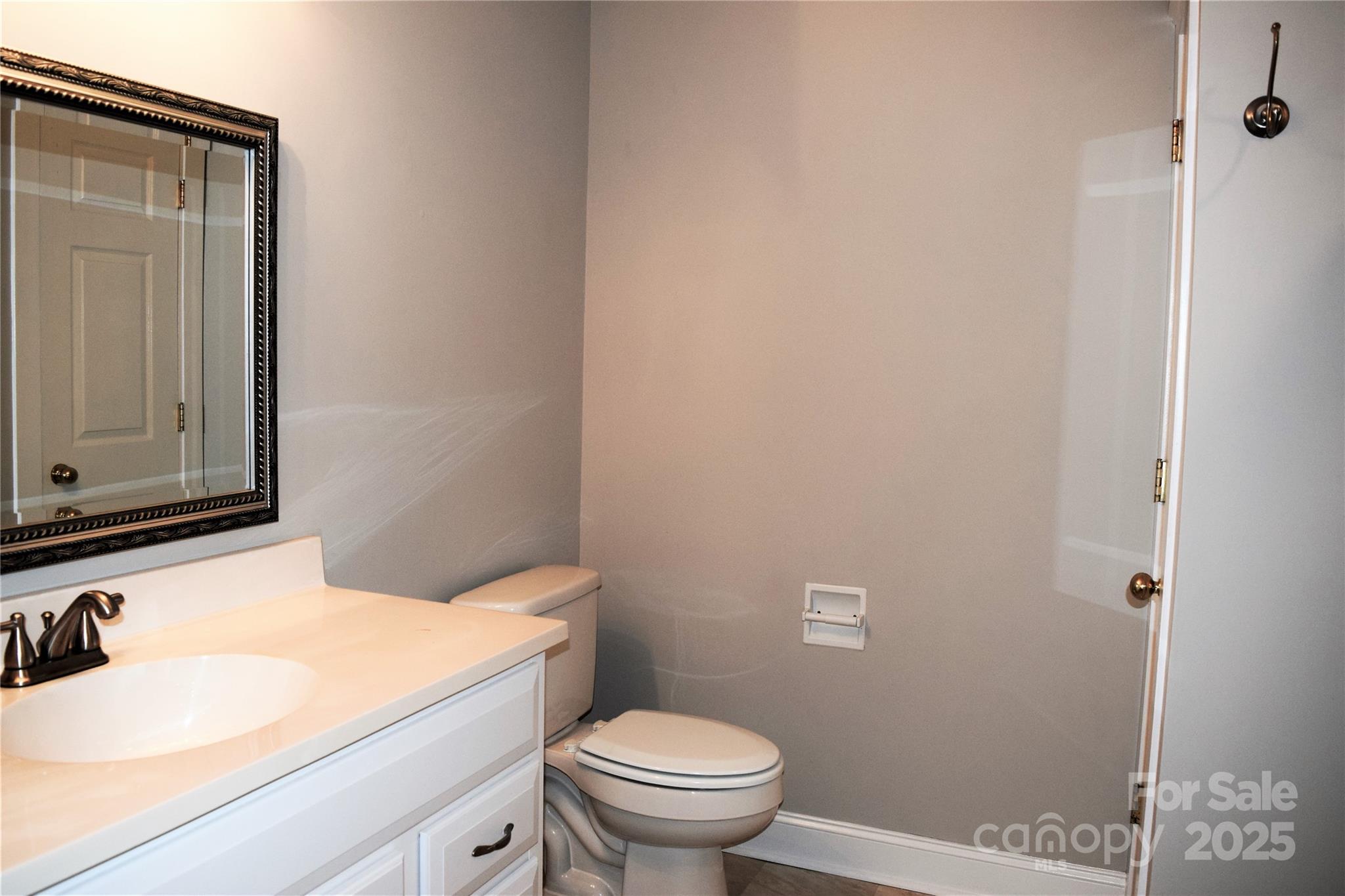 13840 Hastings Farm Road Huntersville, NC 28078 - Photo 26 of 32 a bathroom with a sink and a toilet
