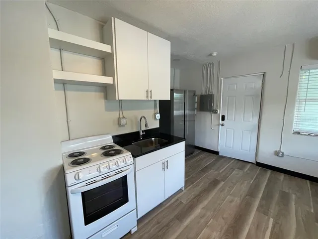 a kitchen with a stove and a microwave